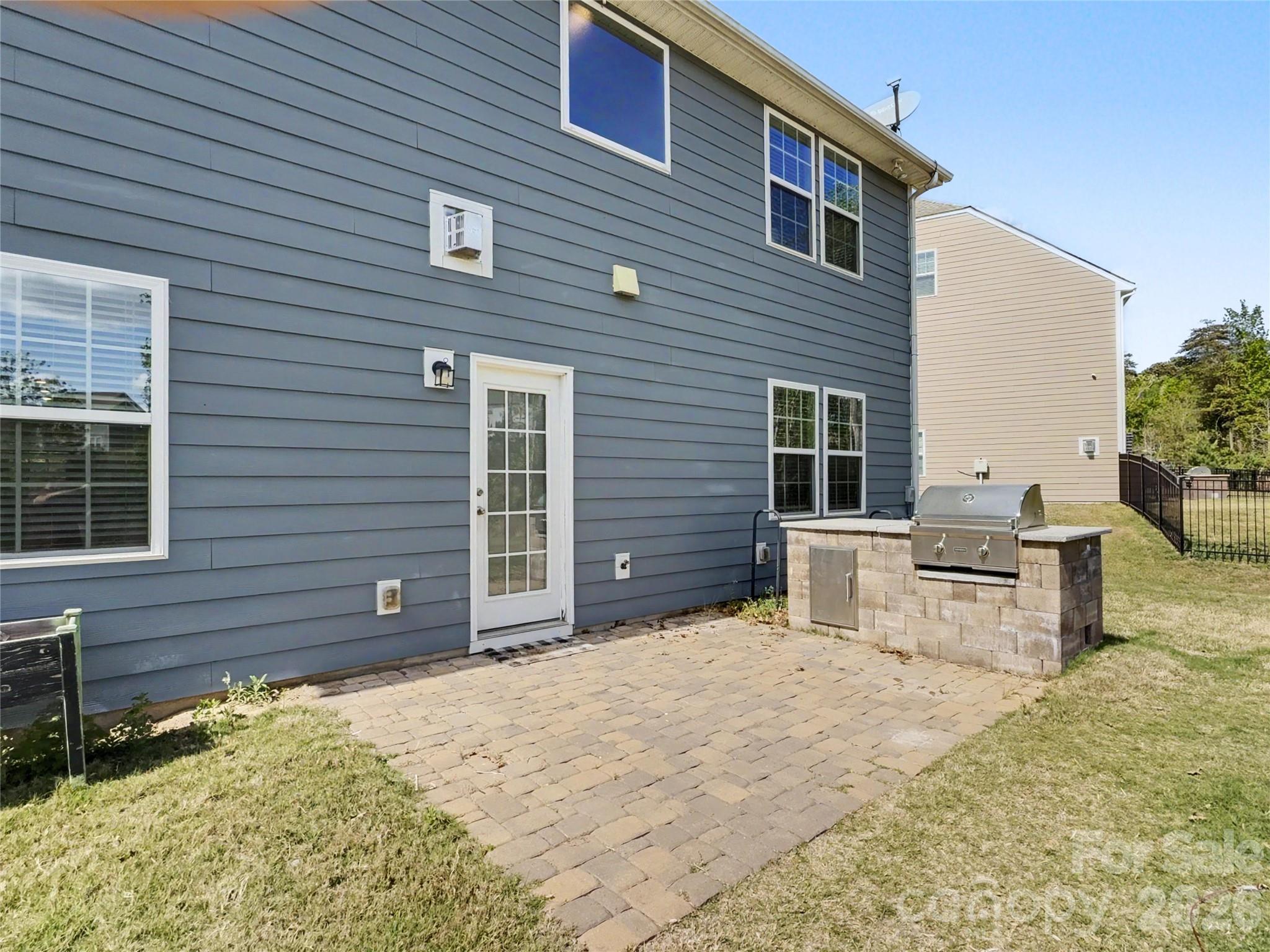 16835 Cozy Cove Road Charlotte, NC 28278 - Photo 27 of 32 a backyard of a house with yard and outdoor seating