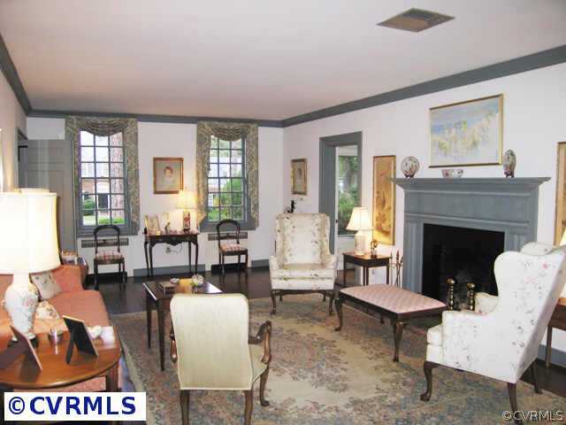 409 Henri Road Richmond, VA 23226 - Photo 3 of 10 a living room with furniture a large window and a fireplace