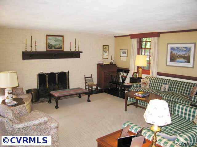 409 Henri Road Richmond, VA 23226 - Photo 7 of 10 a living room with furniture and a wooden floor