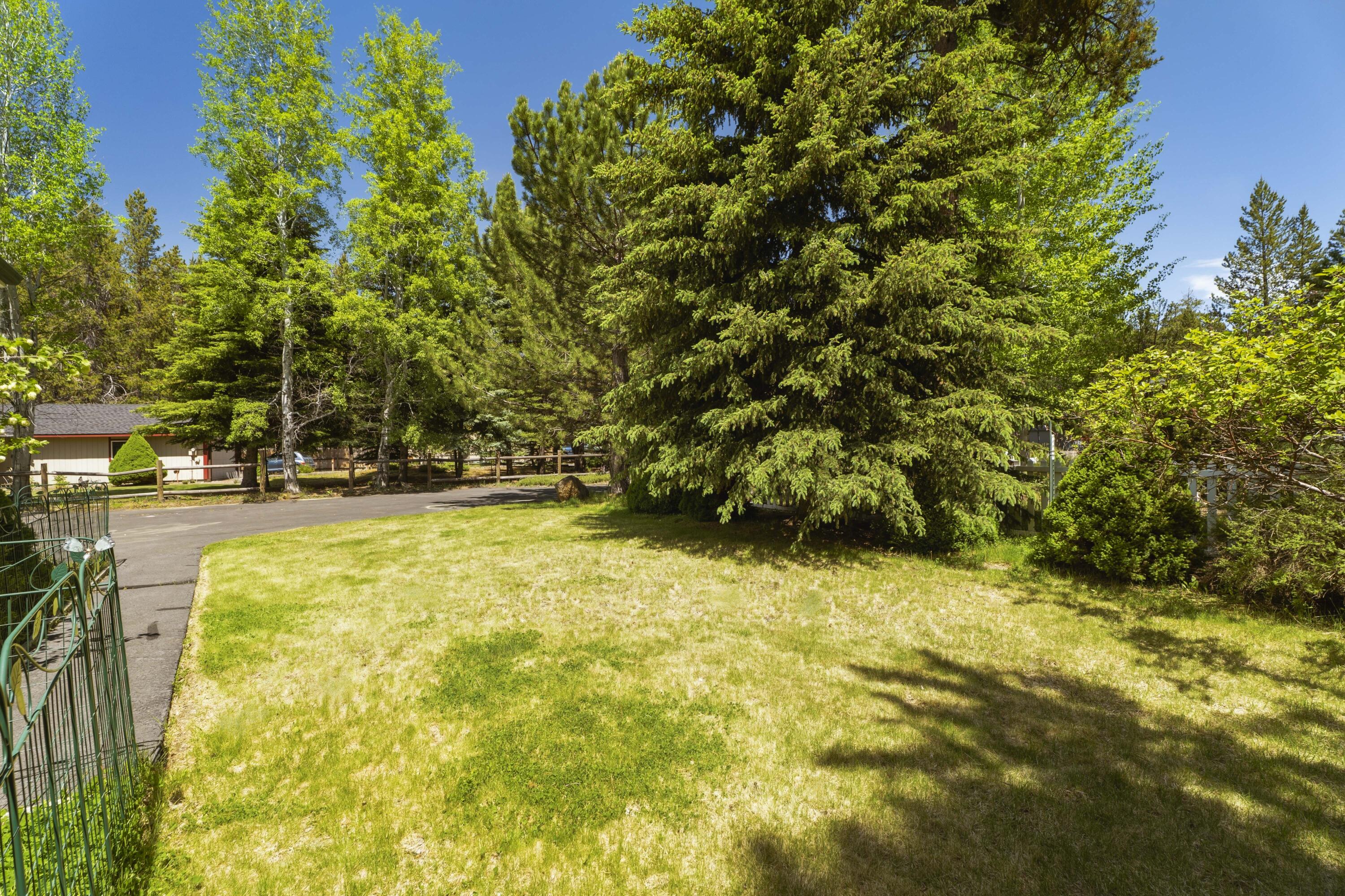 55885 Osprey Road Bend, OR 97707 - Photo 27 of 58 Well maintained grassy spot in the front.