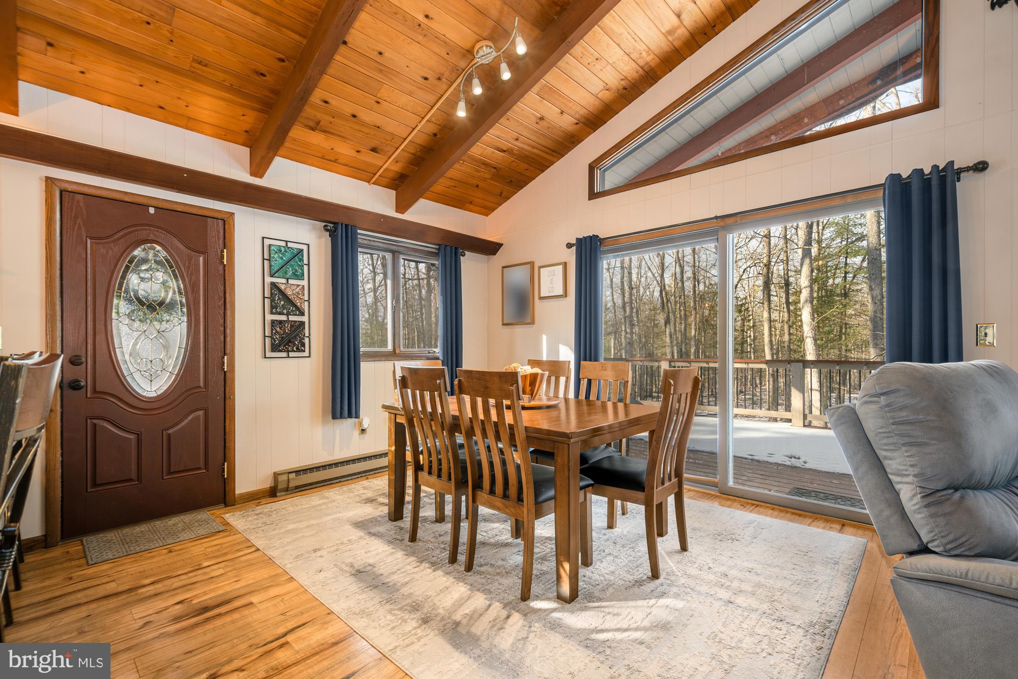 18 Frederick Circle Swanton, MD 21561 - Photo 12 of 63 a dining room with furniture a chandelier and a rug