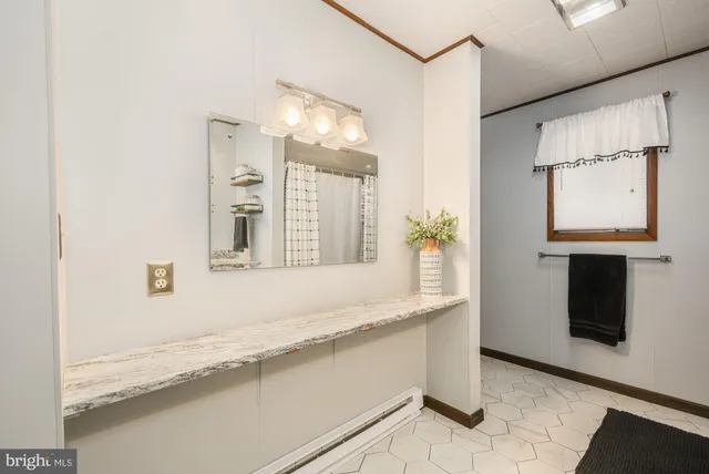 a bedroom with a bed a flat screen tv and balcony view