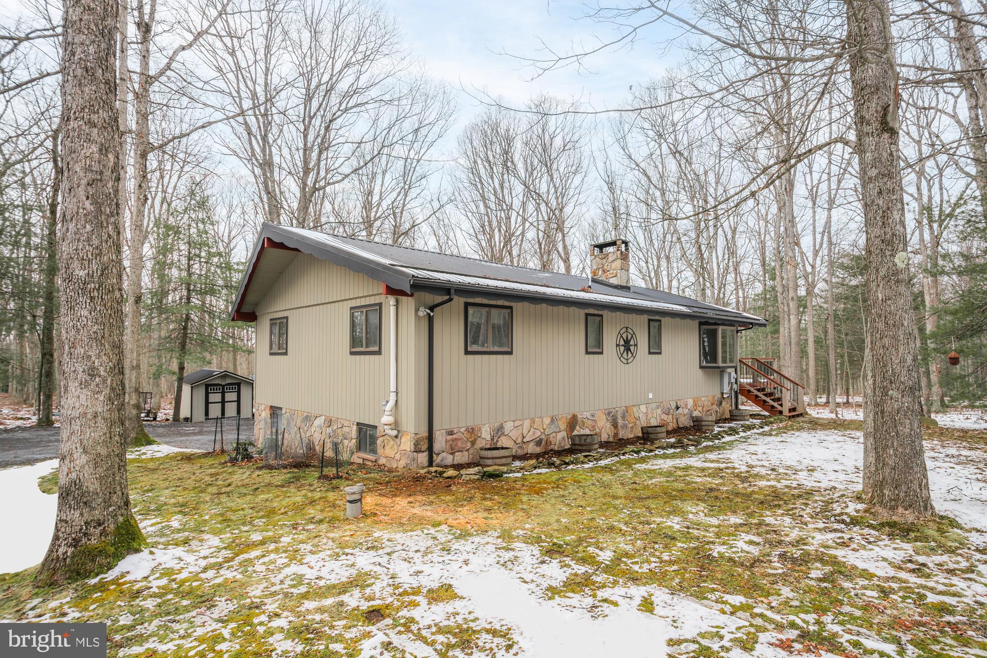 18 Frederick Circle Swanton, MD 21561 - Photo 4 of 63 a view of a house with snow on the background