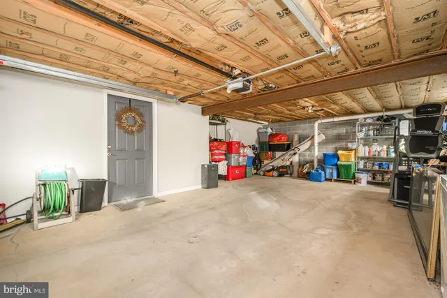 a view of a backyard with table and chairs