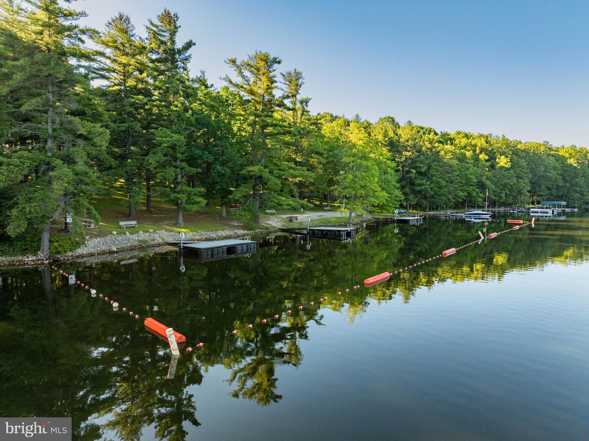 18 Frederick Circle Swanton, MD 21561 - Photo 50 of 63 a view of a lake with a house in the background