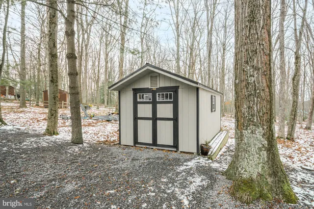 a view of a kitchen with stainless steel appliances granite countertop a stove and a refrigerator