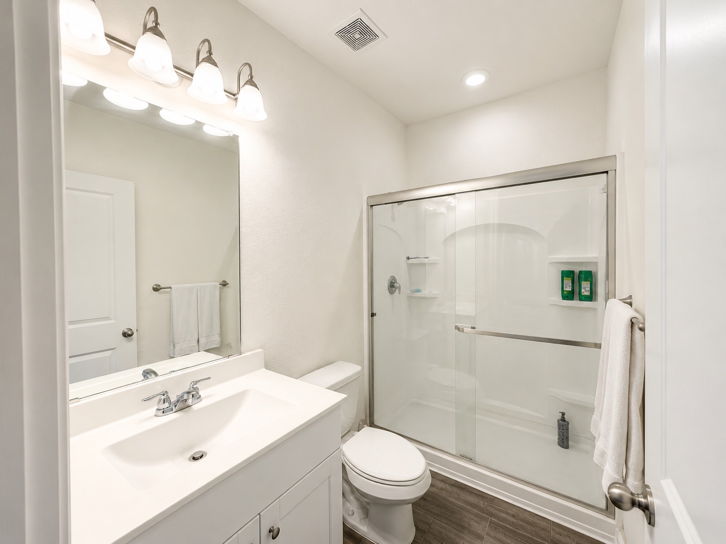 160 Light Timber Road Maxwell, TX 78656 - Photo 6 of 11 A pristine full bathroom features a spacious shower with sliding glass doors and a contemporary vanity.