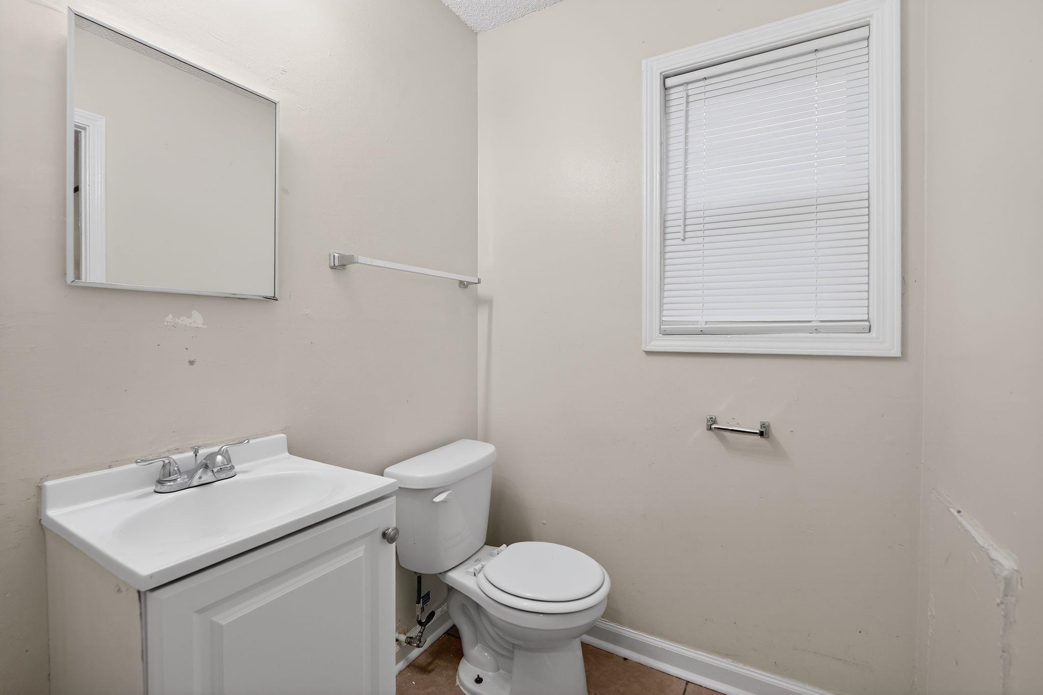 4725 Lofts Road Memphis, TN 38118 - Photo 20 of 32 Half bathroom with vanity and toilet