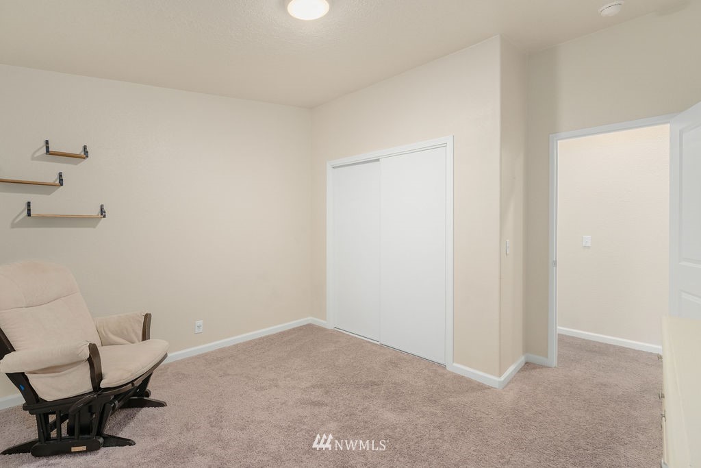 15400 Southeast 155th Place, Unit 7 Renton, WA 98058 - Photo 21 of 26 a workspace with a chair