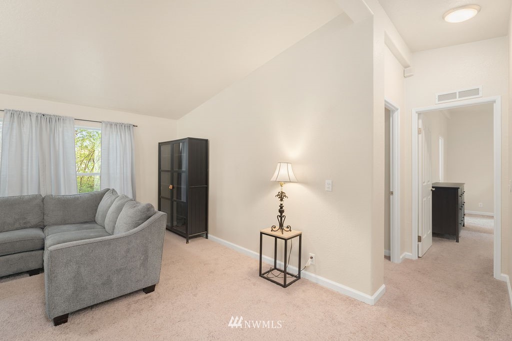 15400 Southeast 155th Place, Unit 7 Renton, WA 98058 - Photo 9 of 26 a living room with furniture and a couch