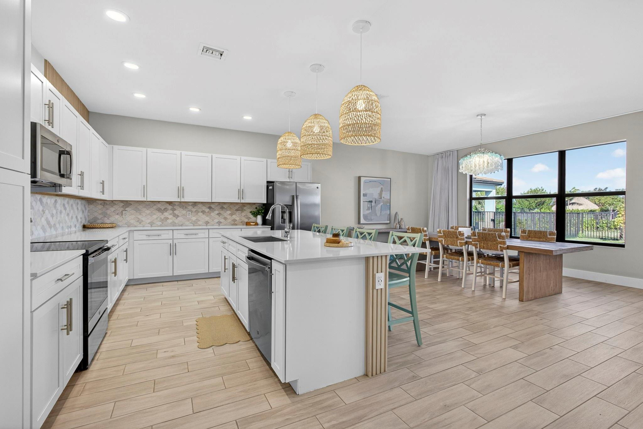 16587 Cove Road The Acreage, FL 33470 - Photo 21 of 69 a kitchen with lots of counter top space and appliances