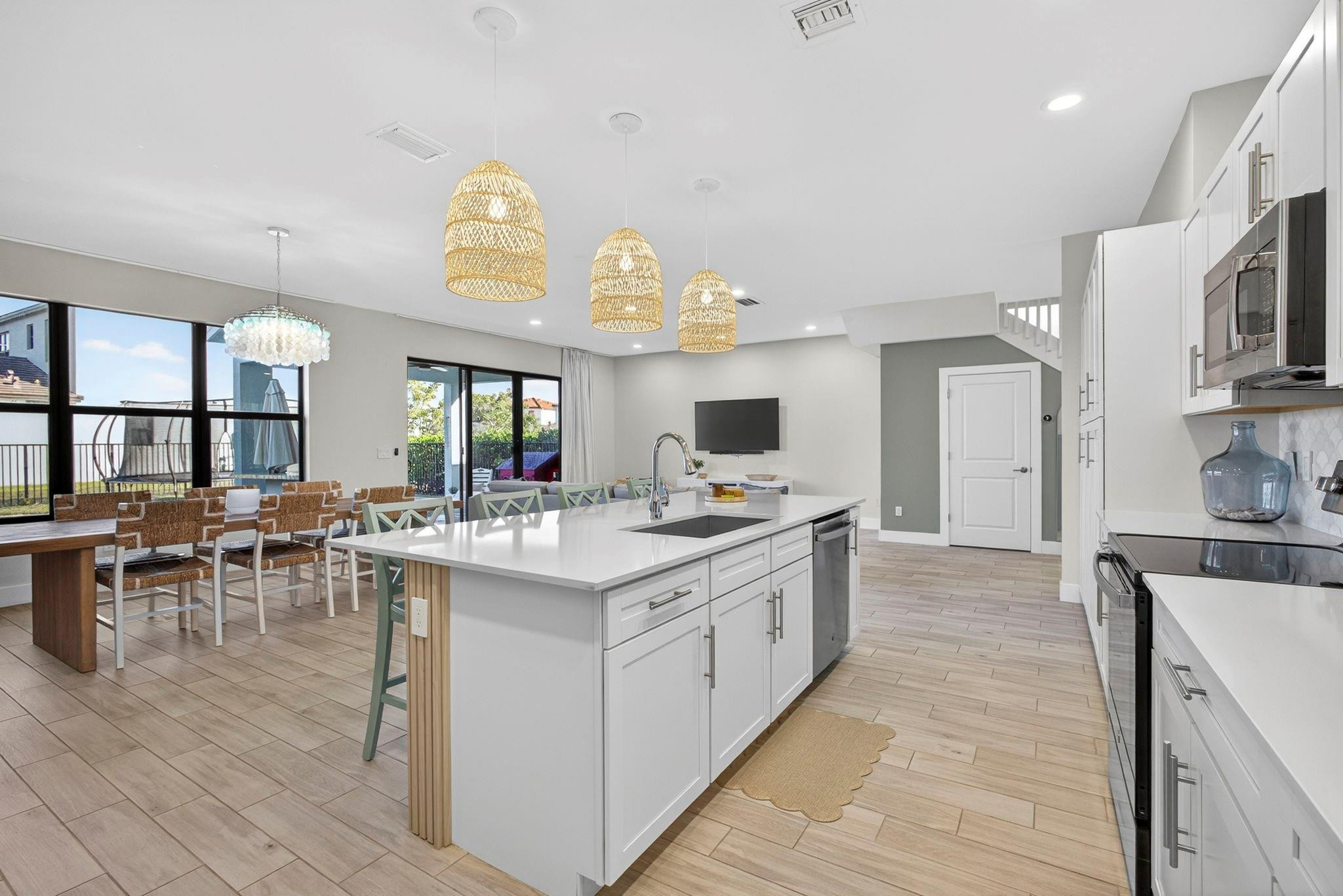 16587 Cove Road The Acreage, FL 33470 - Photo 23 of 69 a large kitchen with lots of counter top space and furniture