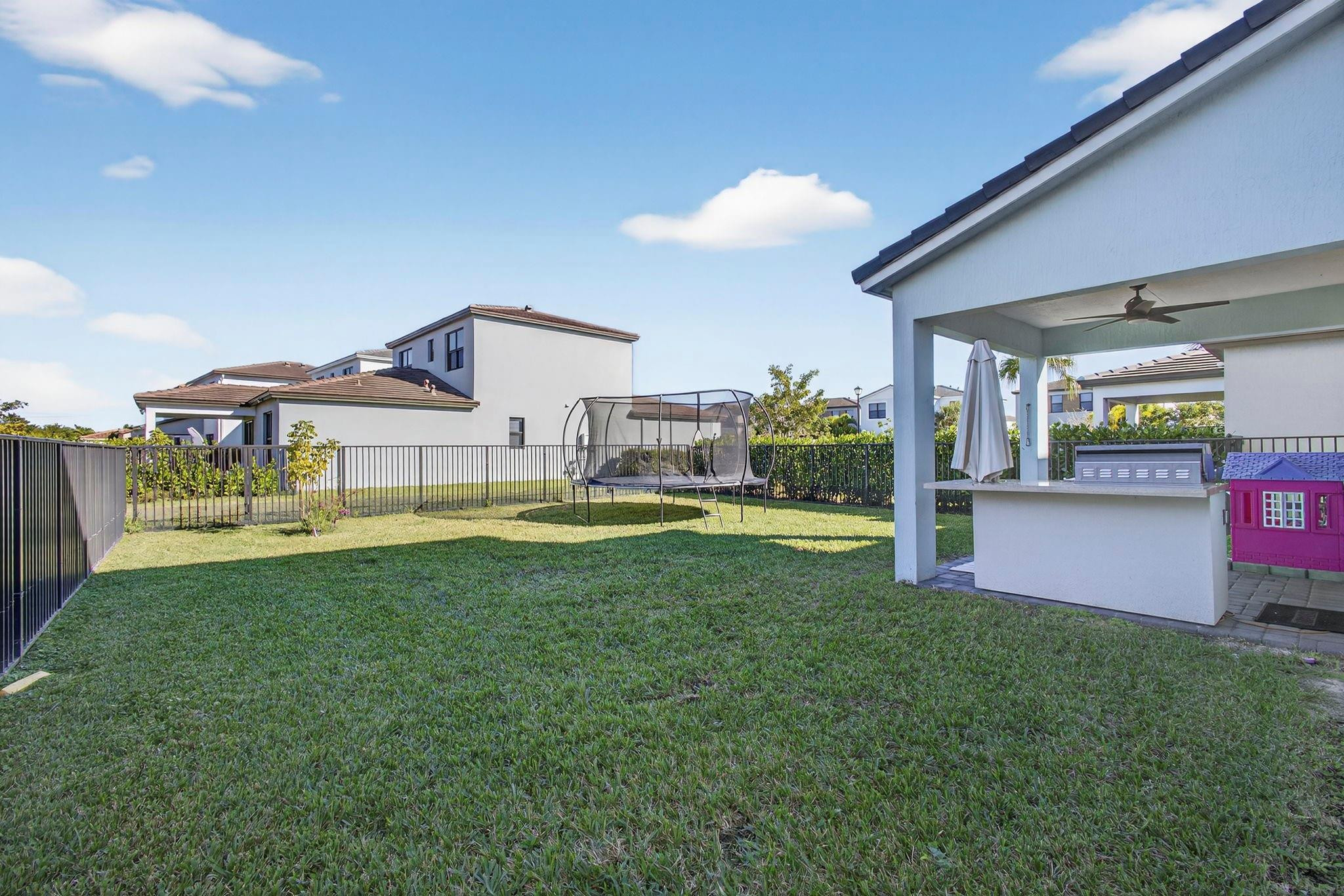 16587 Cove Road The Acreage, FL 33470 - Photo 45 of 69 a view of a house with a swimming pool