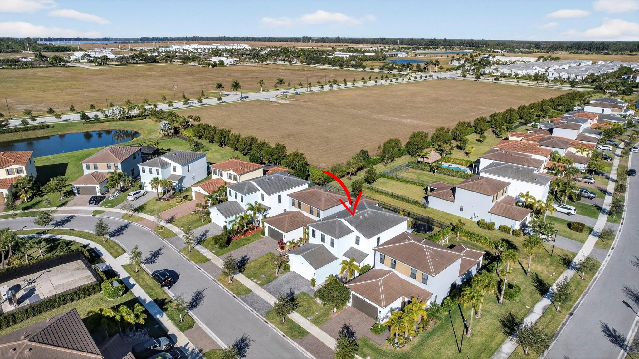16587 Cove Road The Acreage, FL 33470 - Photo 57 of 69 an aerial view of ocean and residential houses with outdoor space