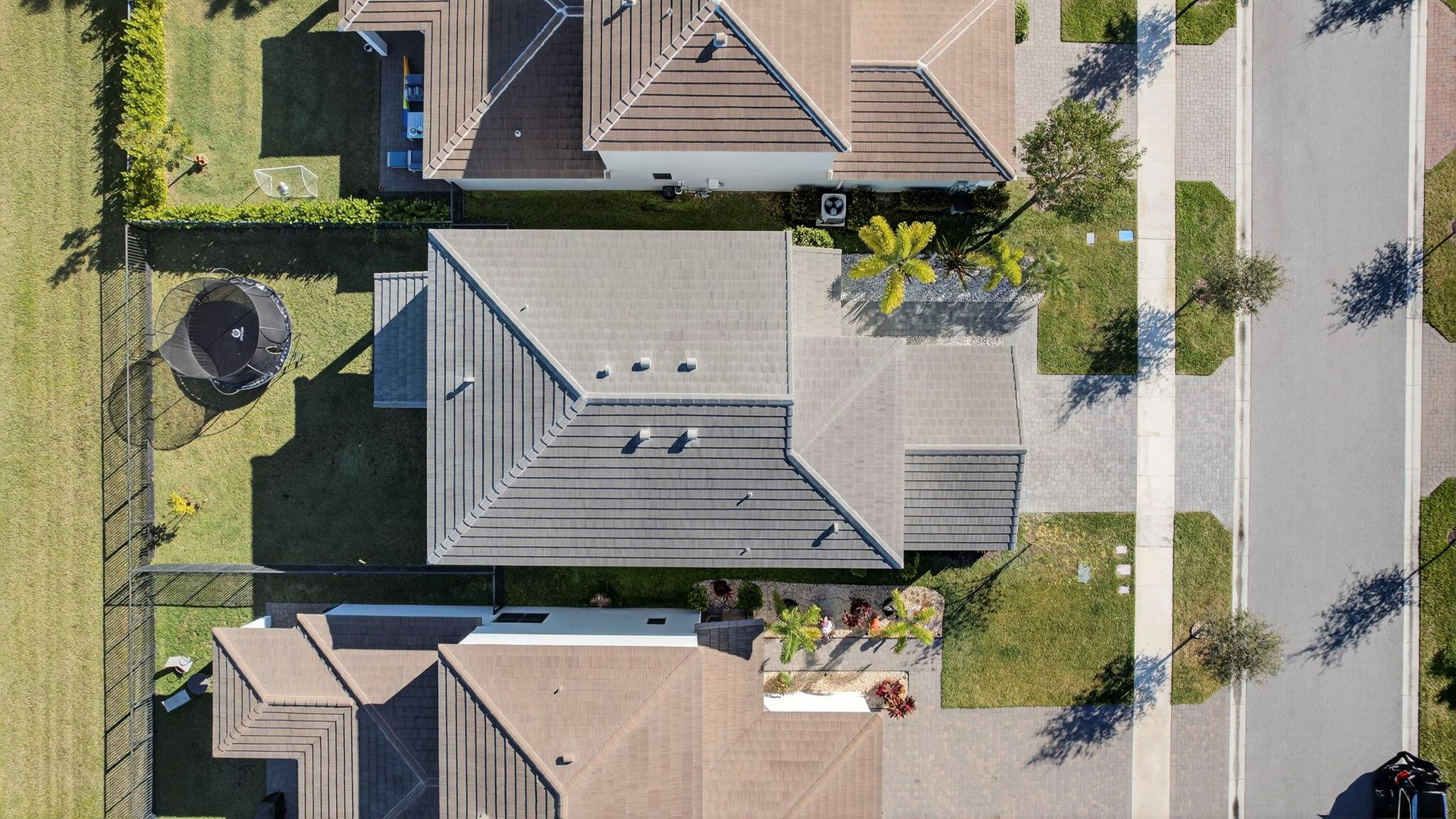 16587 Cove Road The Acreage, FL 33470 - Photo 62 of 69 an aerial view of a house with table and chairs