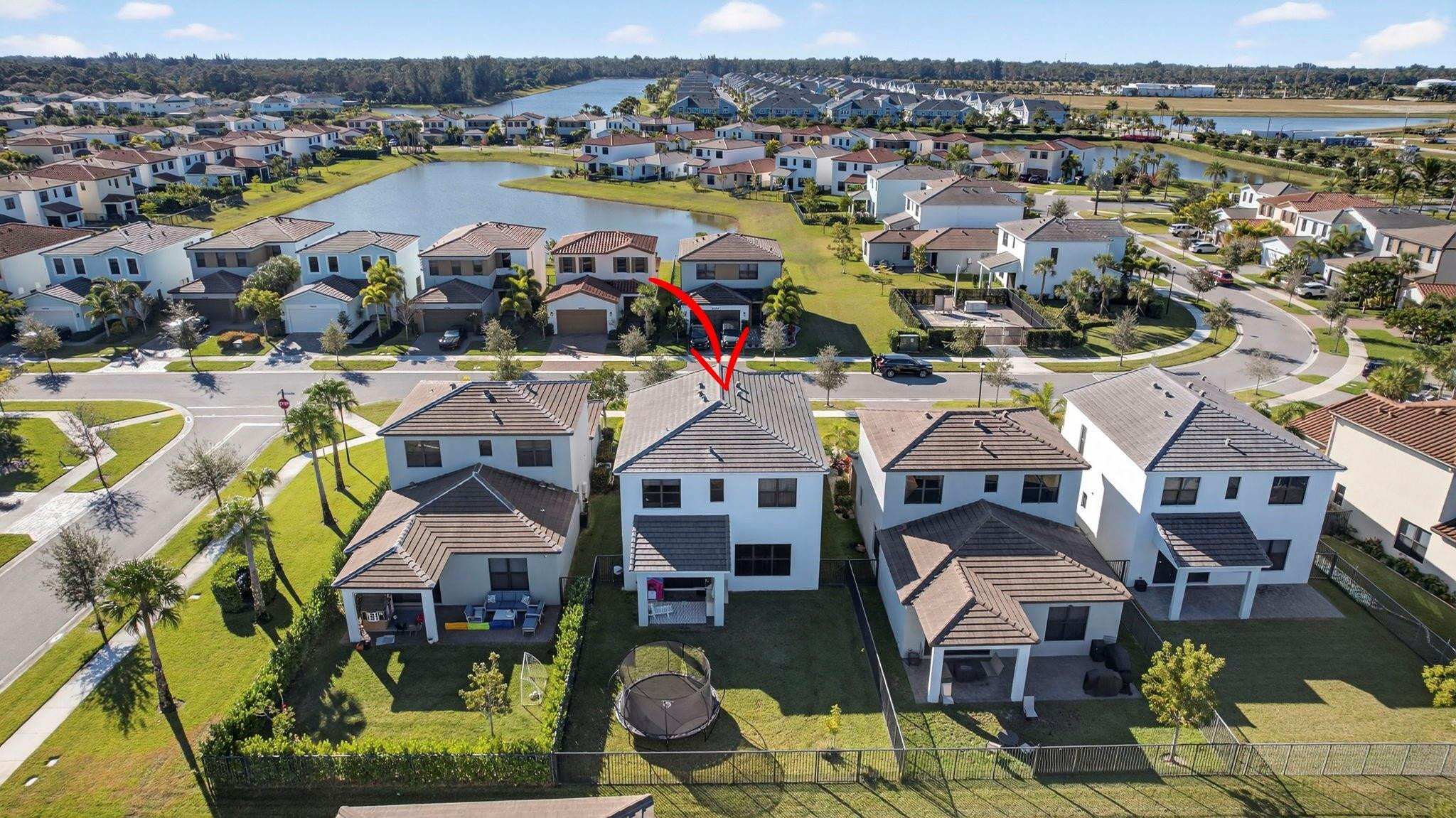 16587 Cove Road The Acreage, FL 33470 - Photo 63 of 69 an aerial view of residential building and lake view