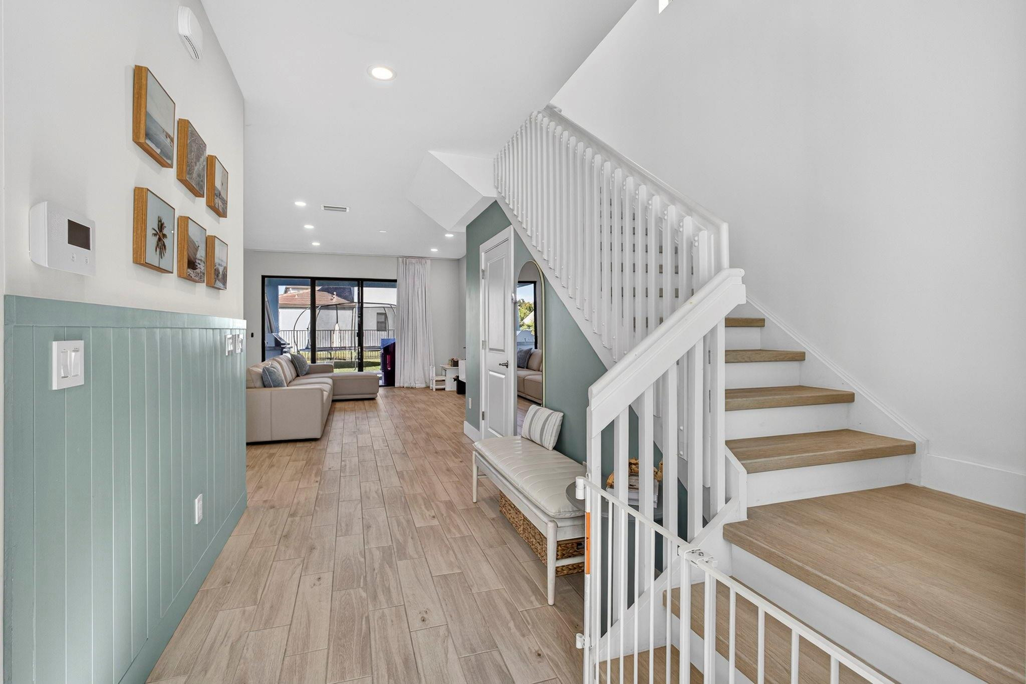 16587 Cove Road The Acreage, FL 33470 - Photo 7 of 69 a view of entryway and hall with wooden floor