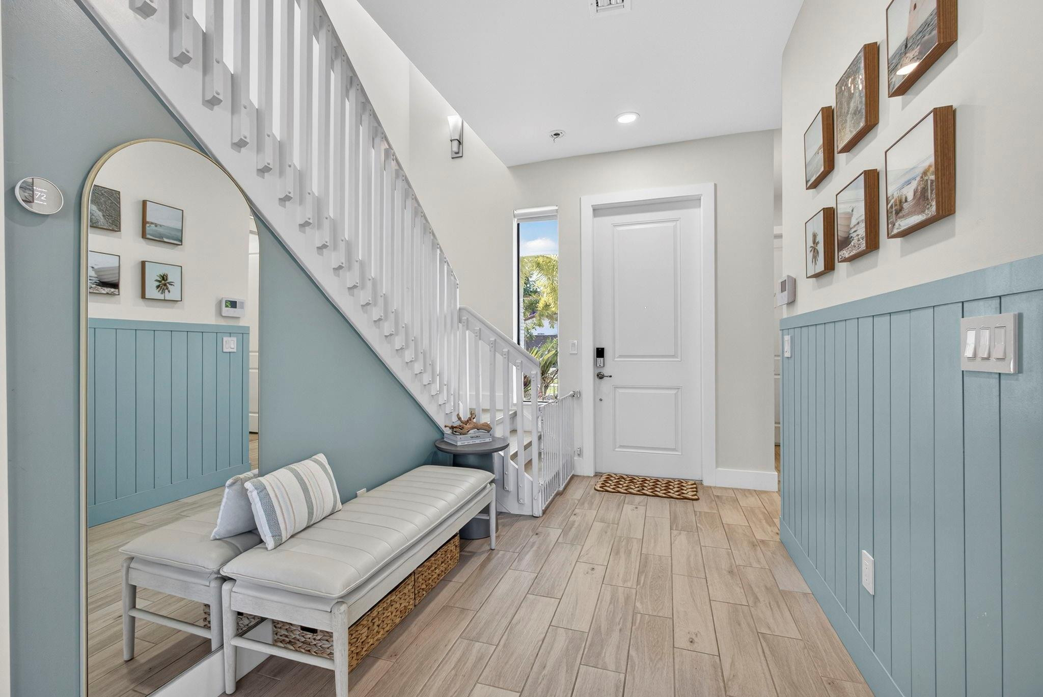 16587 Cove Road The Acreage, FL 33470 - Photo 8 of 69 a view of entryway and hall with wooden floor