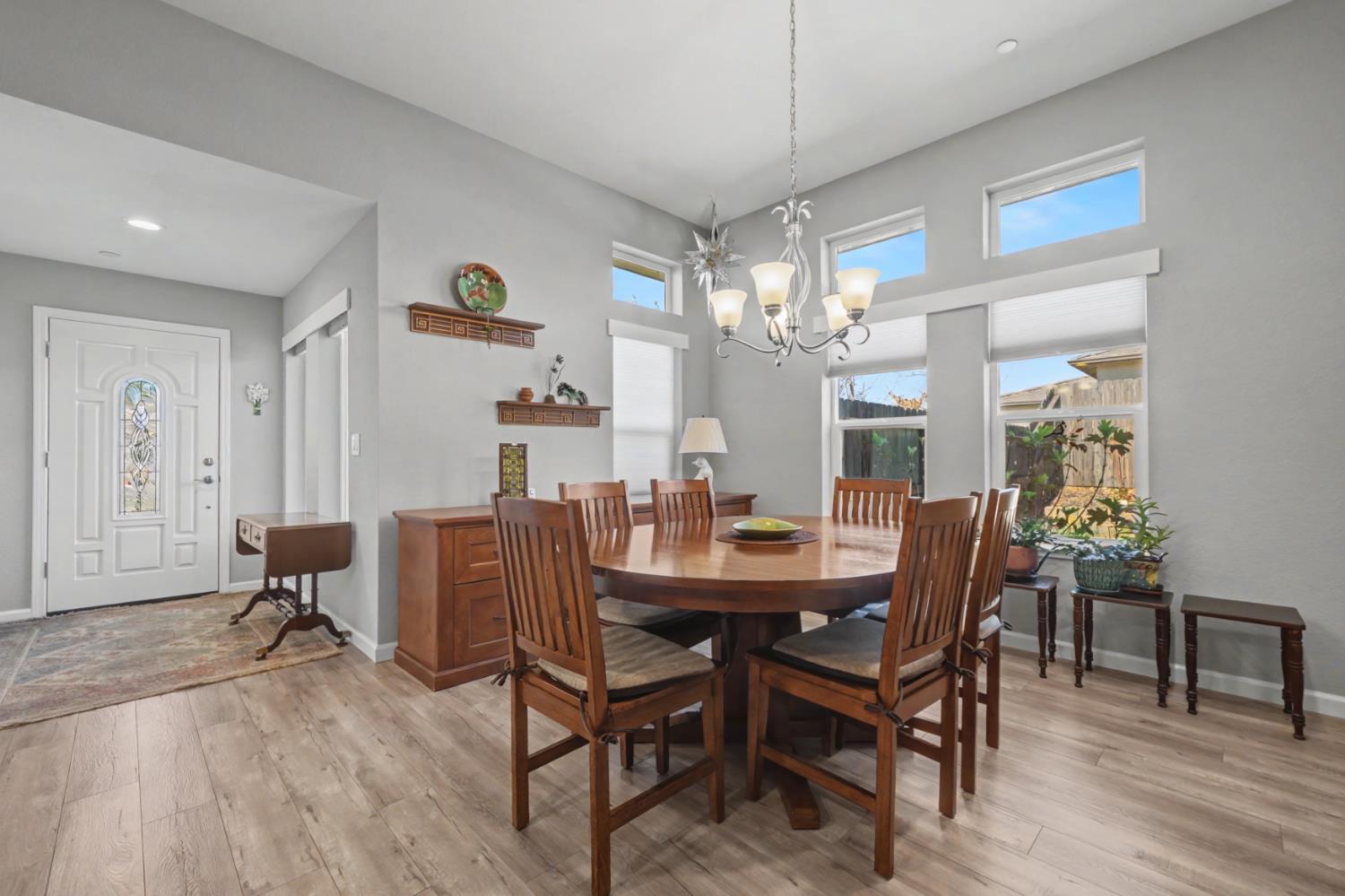 143 Emerald Lane Jackson, CA 95642 - Photo 12 of 53 a dining room with furniture a chandelier and wooden floor