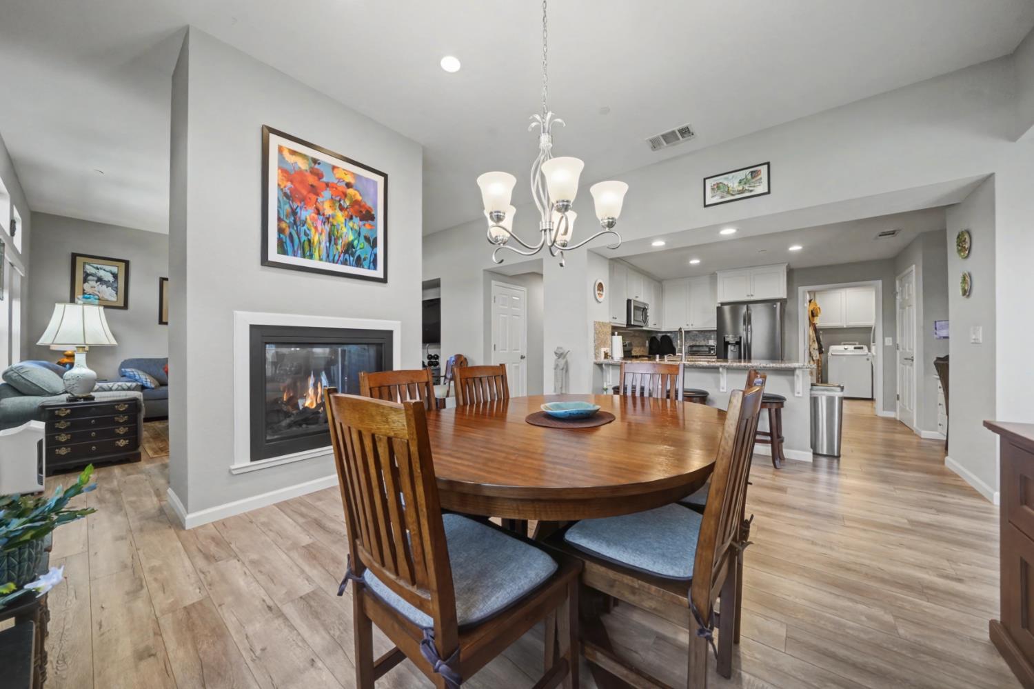 143 Emerald Lane Jackson, CA 95642 - Photo 14 of 53 a view of a dining room with furniture wooden floor and a fireplace