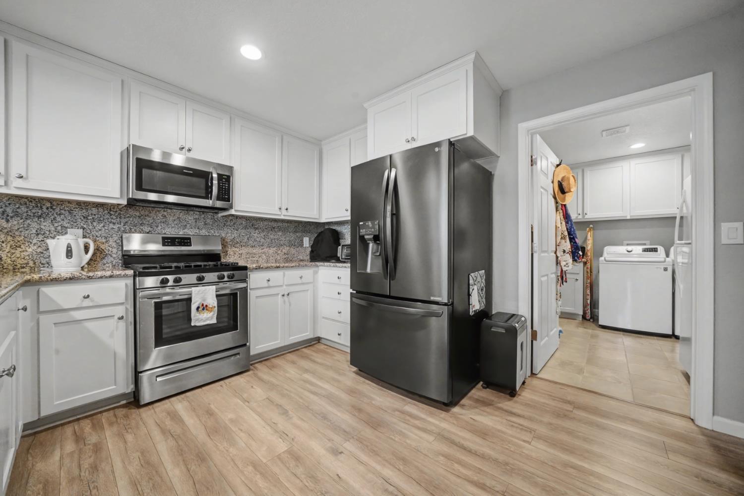 143 Emerald Lane Jackson, CA 95642 - Photo 17 of 53 a kitchen with stainless steel appliances granite countertop a refrigerator stove and oven