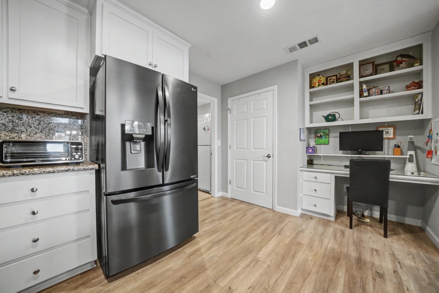 143 Emerald Lane Jackson, CA 95642 - Photo 20 of 53 a kitchen with stainless steel appliances a refrigerator and wooden cabinets