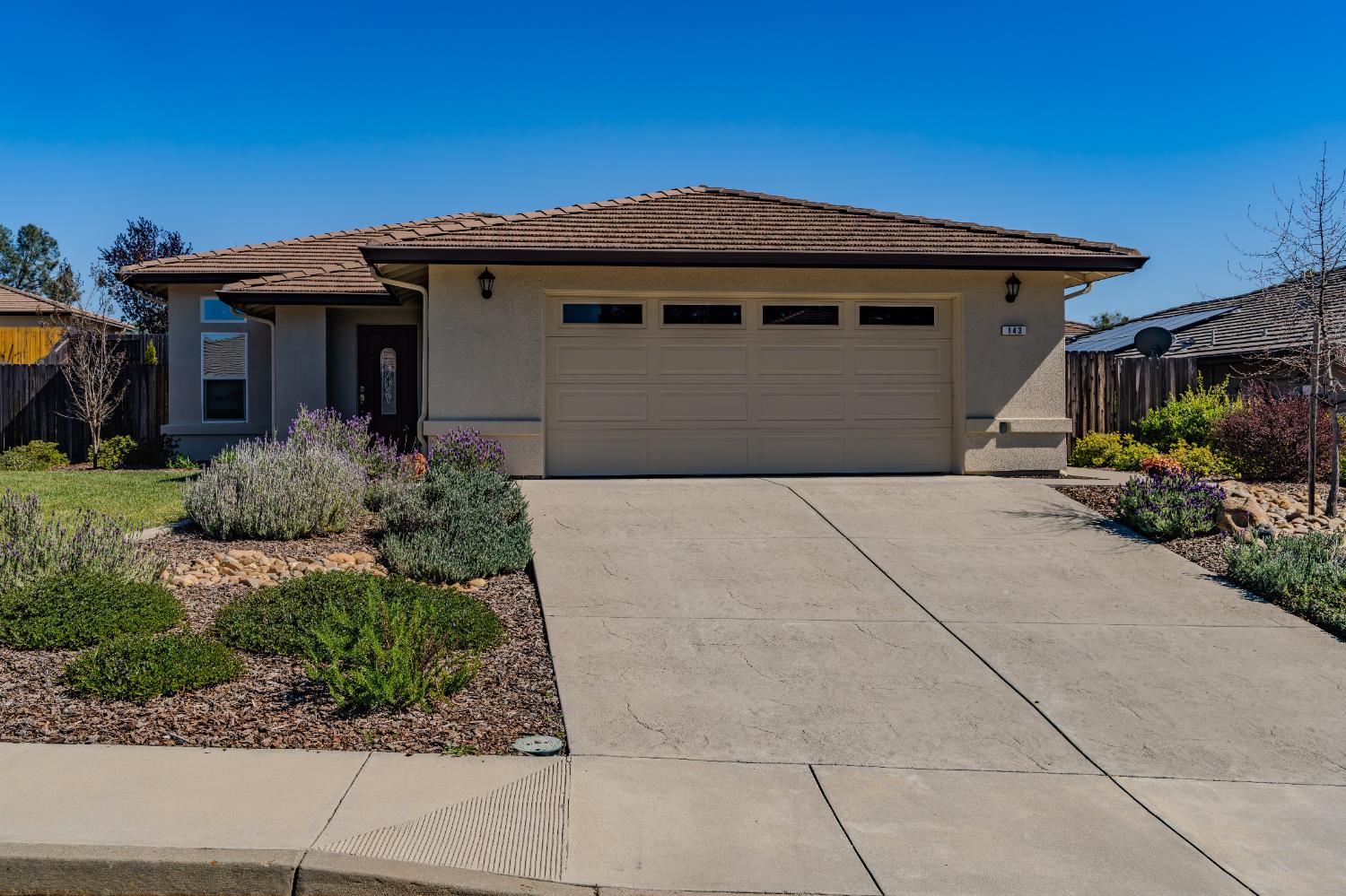 143 Emerald Lane Jackson, CA 95642 - Photo 2 of 53 a front view of a house with garden
