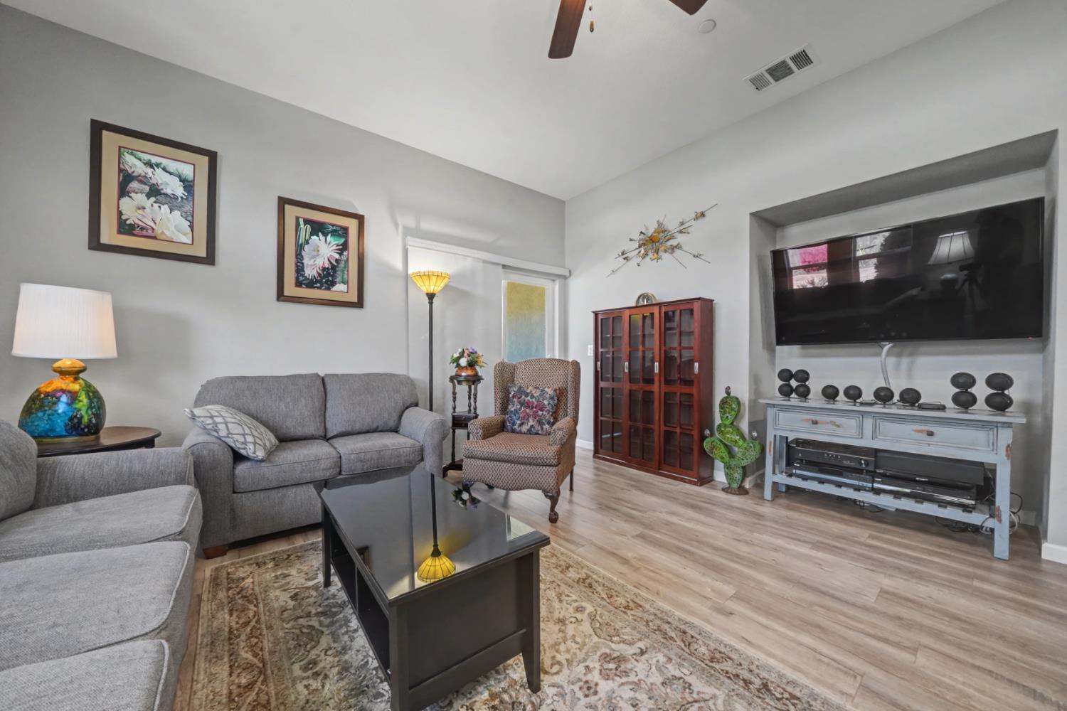 143 Emerald Lane Jackson, CA 95642 - Photo 23 of 53 a living room with furniture and a flat screen tv