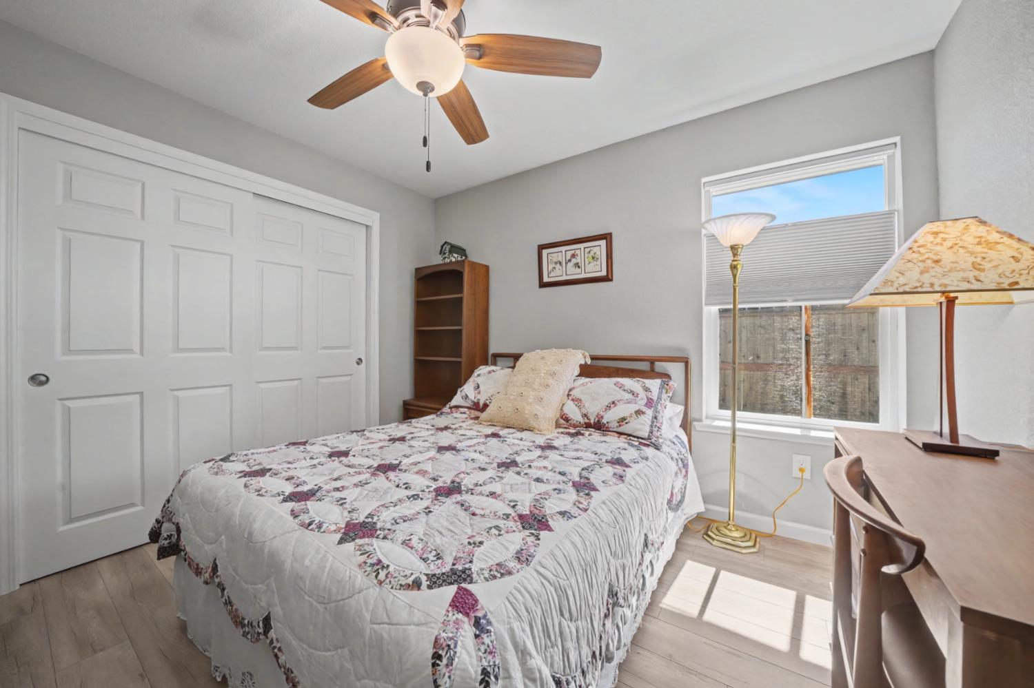 143 Emerald Lane Jackson, CA 95642 - Photo 28 of 53 a bedroom with a bed and a chandelier