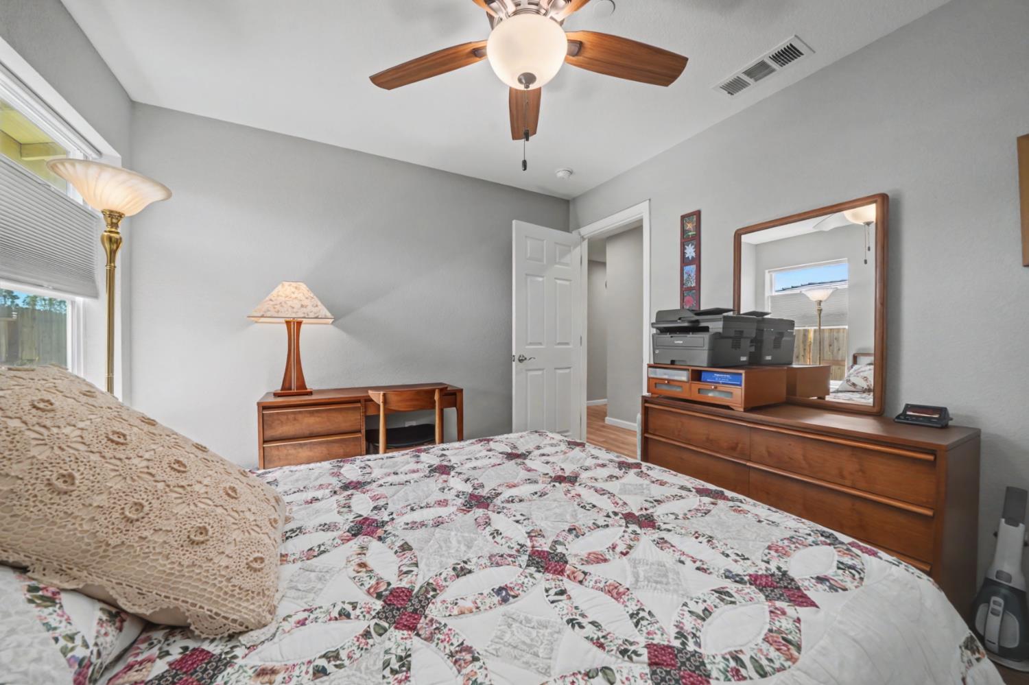 143 Emerald Lane Jackson, CA 95642 - Photo 29 of 53 a bedroom with a bed and a chandelier