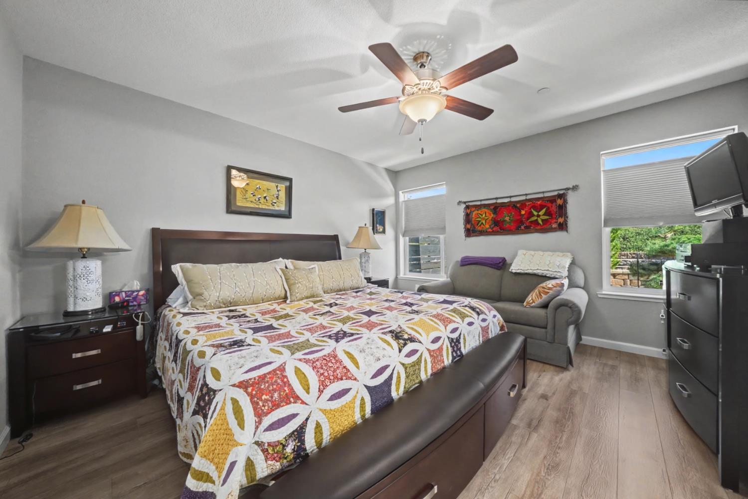 143 Emerald Lane Jackson, CA 95642 - Photo 31 of 53 a bedroom with a bed and a chandelier