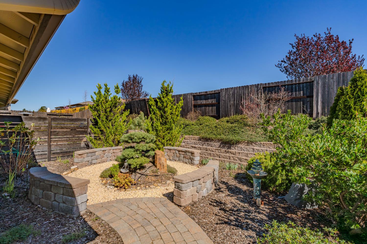 143 Emerald Lane Jackson, CA 95642 - Photo 39 of 53 a view of a backyard with plants and a patio