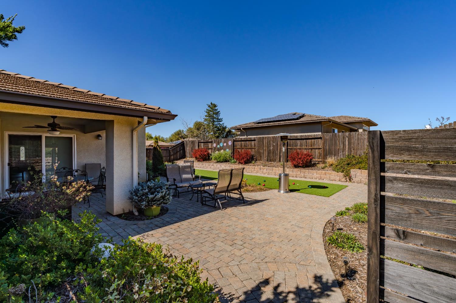 143 Emerald Lane Jackson, CA 95642 - Photo 41 of 53 a view of a house with backyard sitting area and garden
