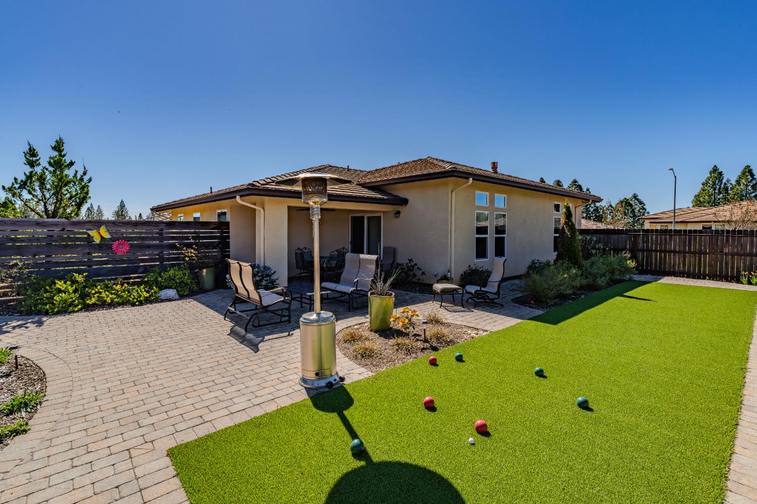 143 Emerald Lane Jackson, CA 95642 - Photo 44 of 53 a view of a patio with table and chairs potted plants with wooden fence