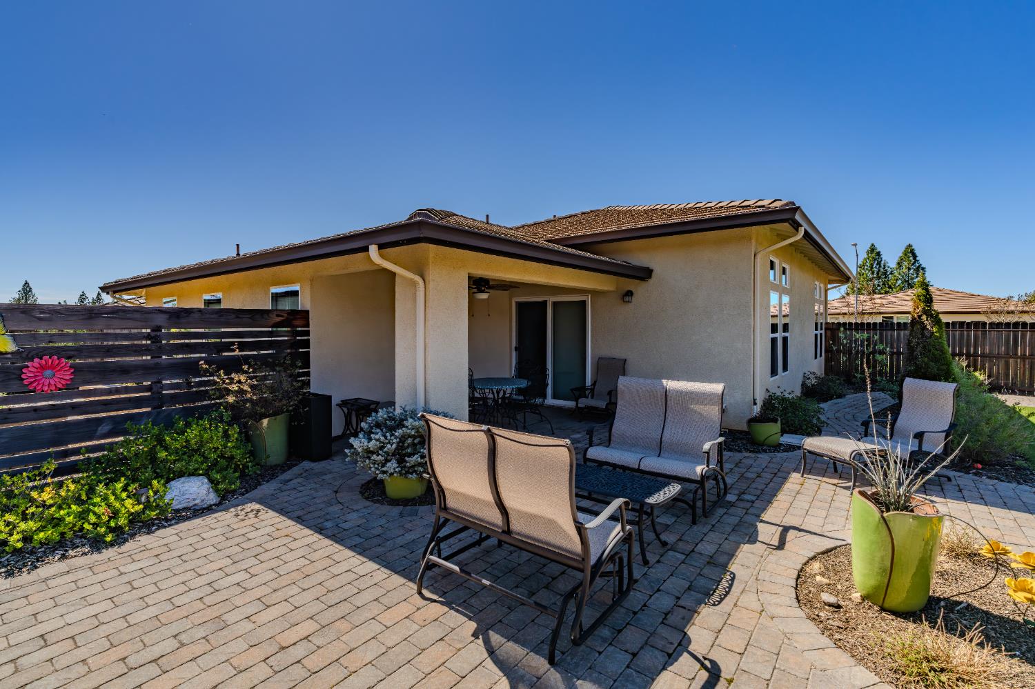 143 Emerald Lane Jackson, CA 95642 - Photo 45 of 53 a view of a patio with table and chairs with wooden floor and fence