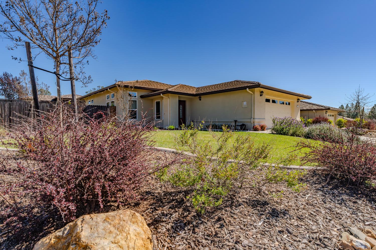 143 Emerald Lane Jackson, CA 95642 - Photo 5 of 53 a view of a large house with a big yard plants and large trees
