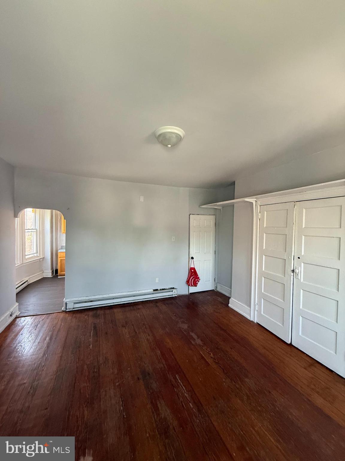 5336 Vine Street, Unit 2F Philadelphia, PA 19139 - Photo 3 of 7 a view of empty room with wooden floor and fan
