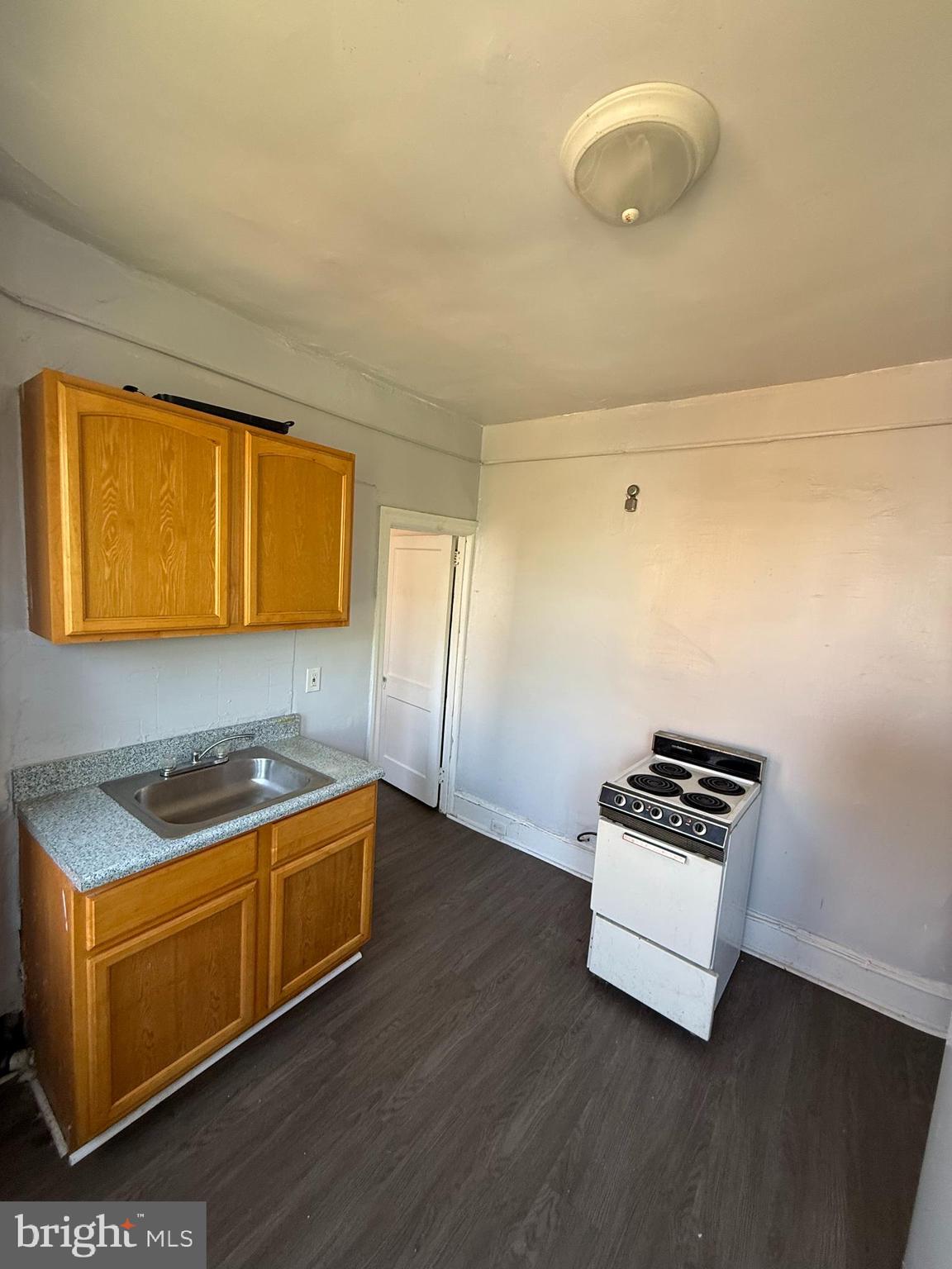 5336 Vine Street, Unit 2F Philadelphia, PA 19139 - Photo 4 of 7 a room with furniture and wooden floor
