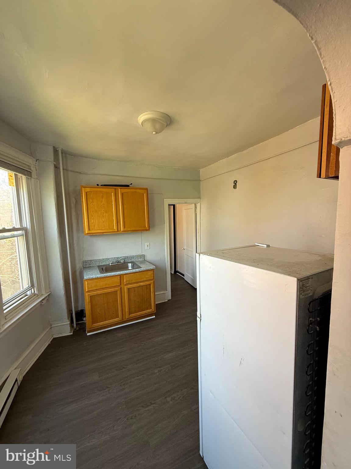 5336 Vine Street, Unit 2F Philadelphia, PA 19139 - Photo 5 of 7 a room with a bed and a television