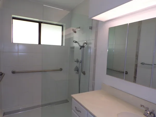 a bathroom with a bathtub and shower
