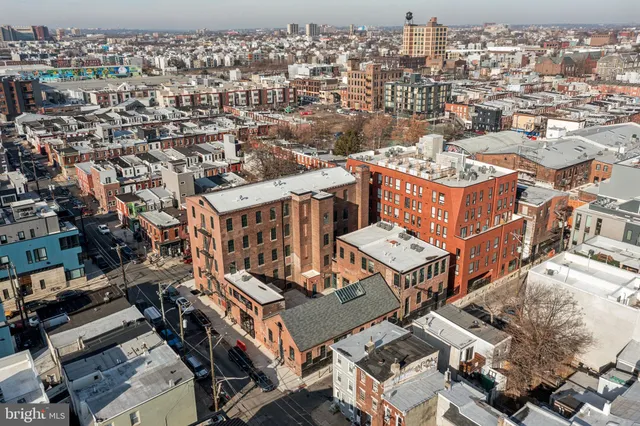 an aerial view of a house with a city view
