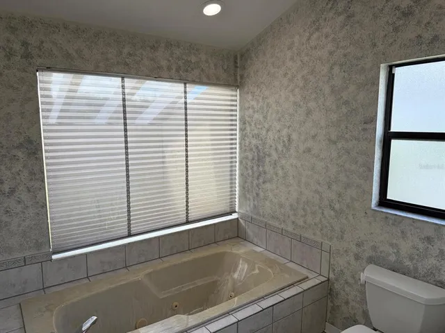 a view of a backyard with sitting area