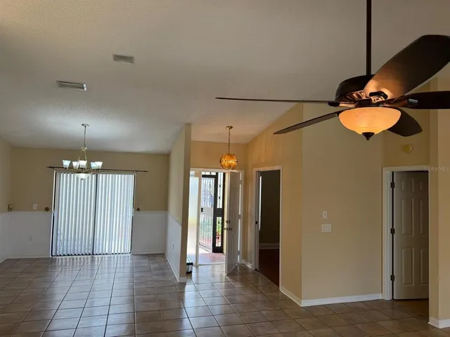 a view of a hallway with a chandelier