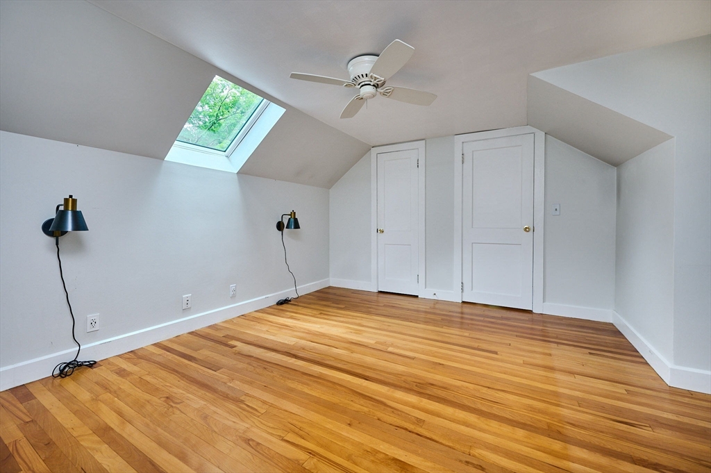 145 Chesterfield Road Northampton, MA 01053 - Photo 21 of 42 a view of an empty room with a chandelier fan and a window