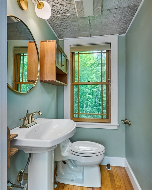 145 Chesterfield Road Northampton, MA 01053 - Photo 24 of 42 a bathroom with a toilet a sink and mirror