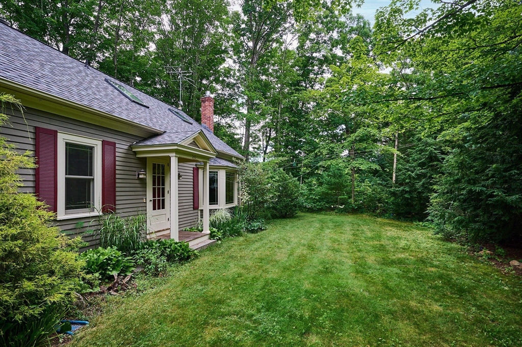 145 Chesterfield Road Northampton, MA 01053 - Photo 3 of 42 a view of a house with a yard