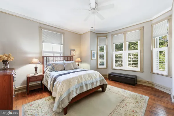 a bedroom with a bed and a fireplace