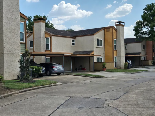 a view of a building with a yard