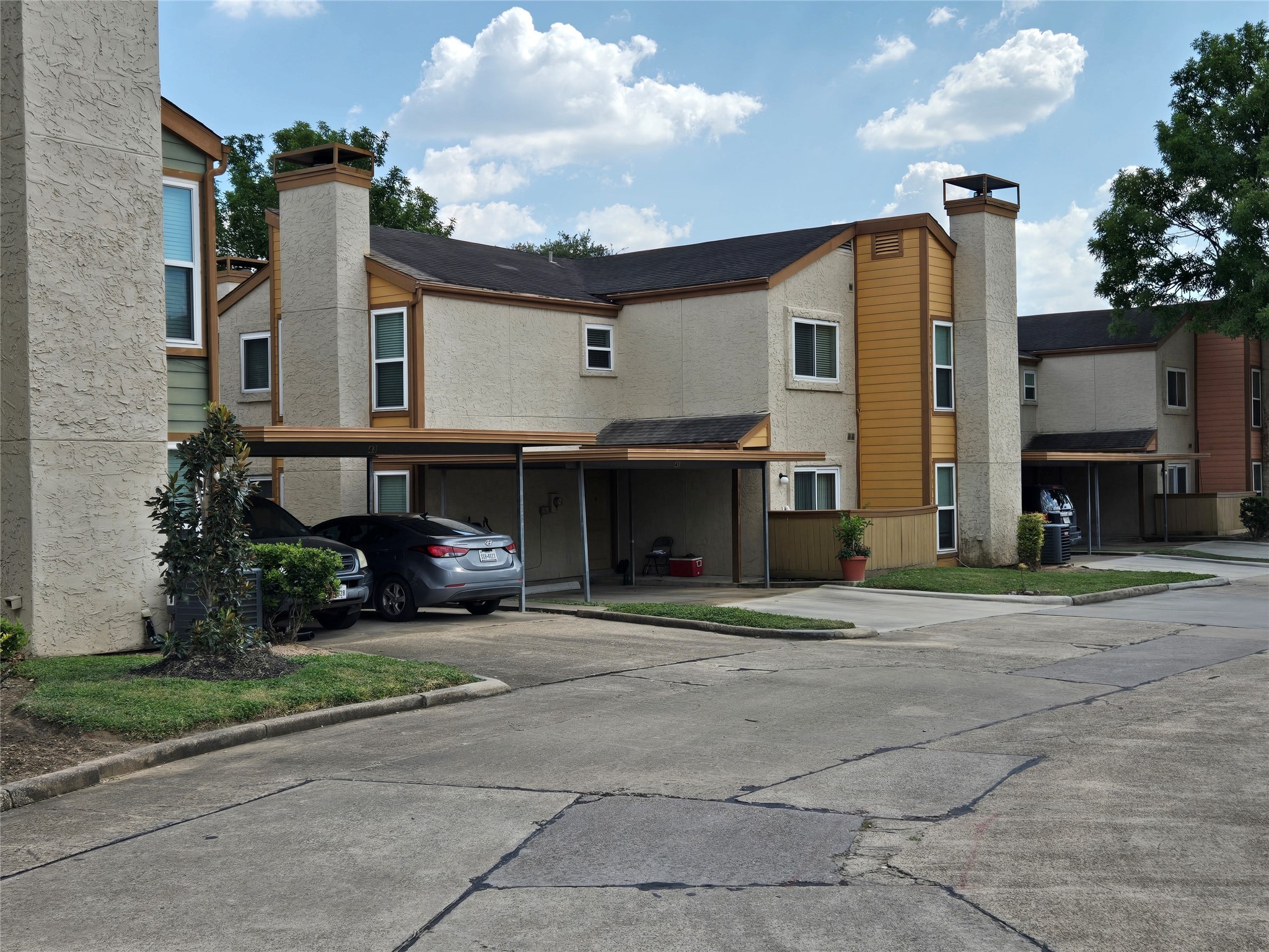 13210 Old Richmond Road, Unit A Houston, TX 77083 - Photo 4 of 21 a view of a building with a yard