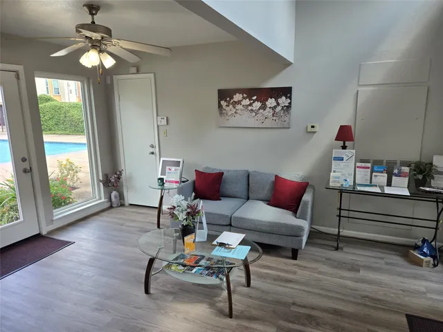 a living room with furniture and a window
